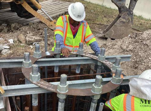 Construction work for bicycle and pedestrian sidewalk crossing underpass.